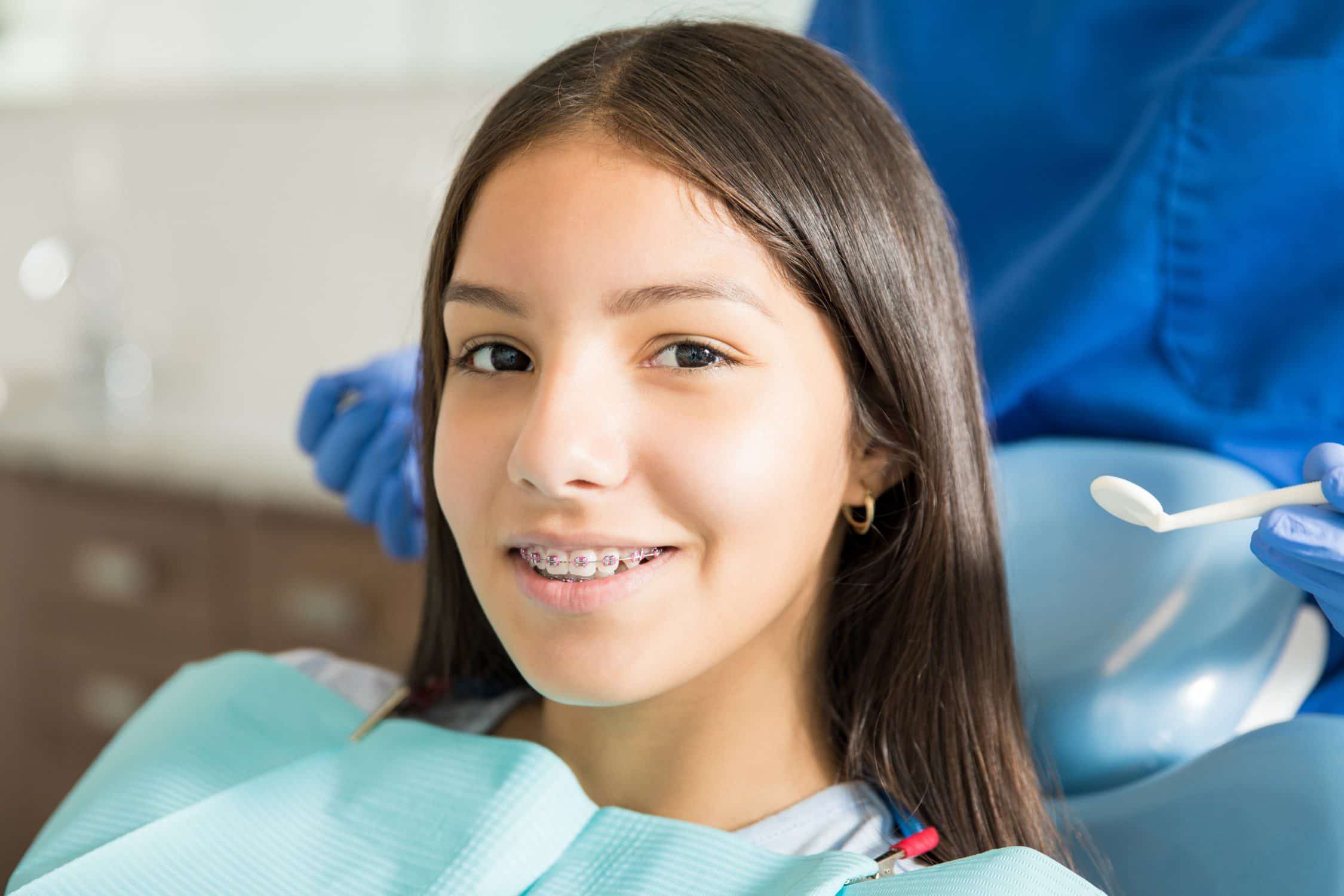 girl in braces at the dentist