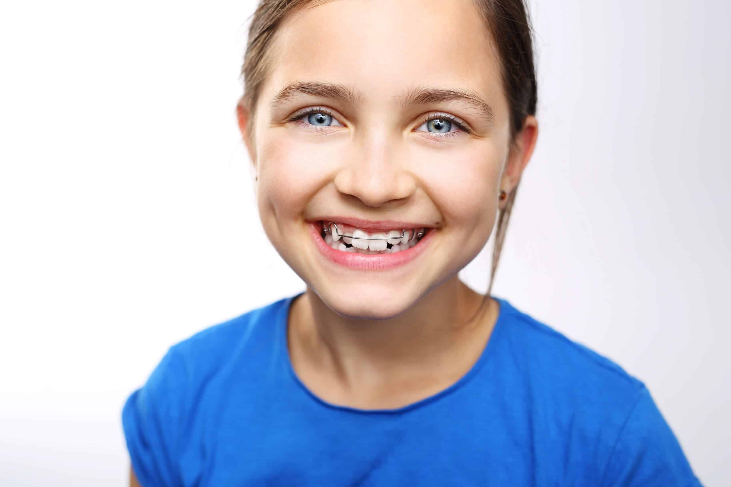 Young girl smiling in a retainer