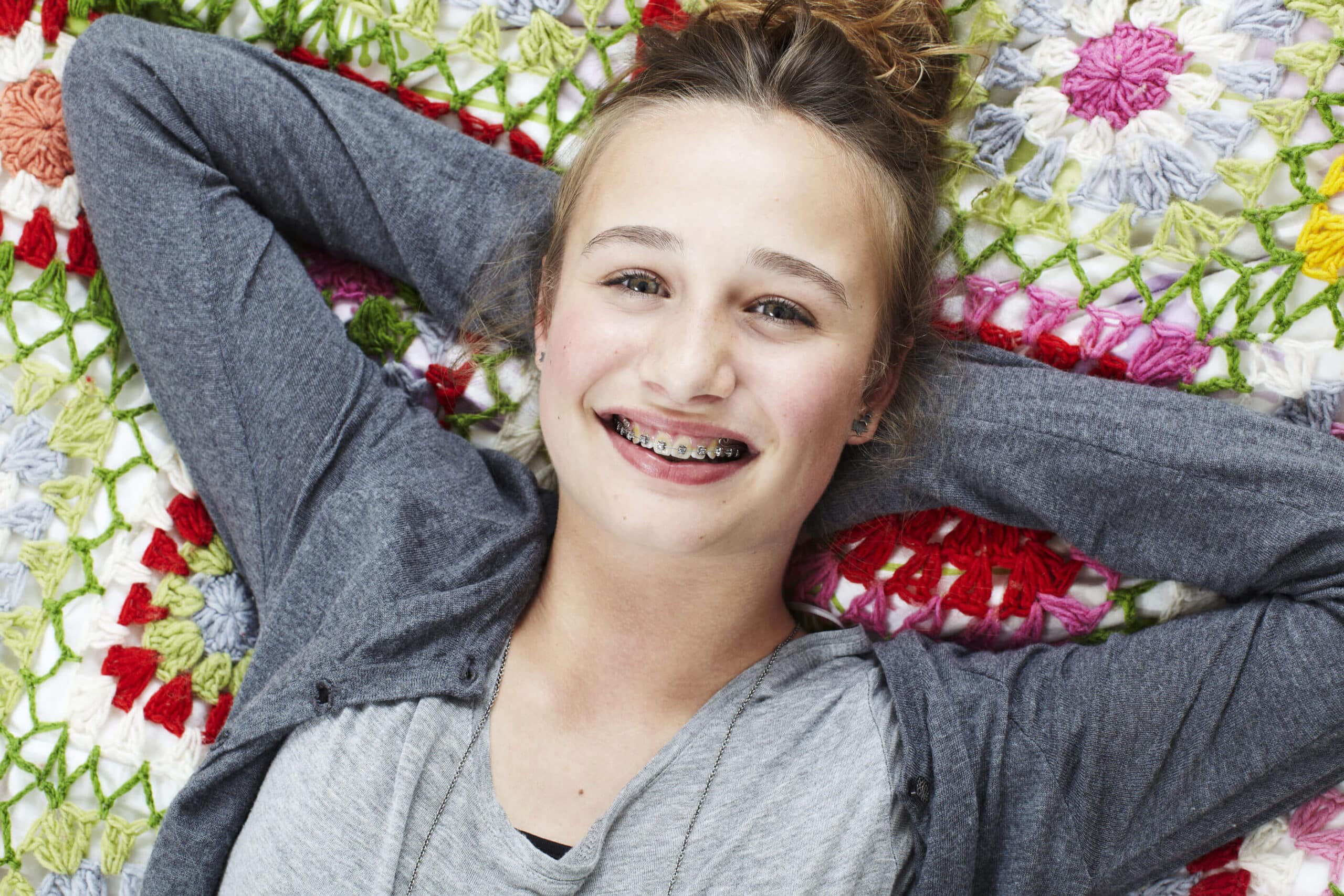 Teen girl smiling with braces