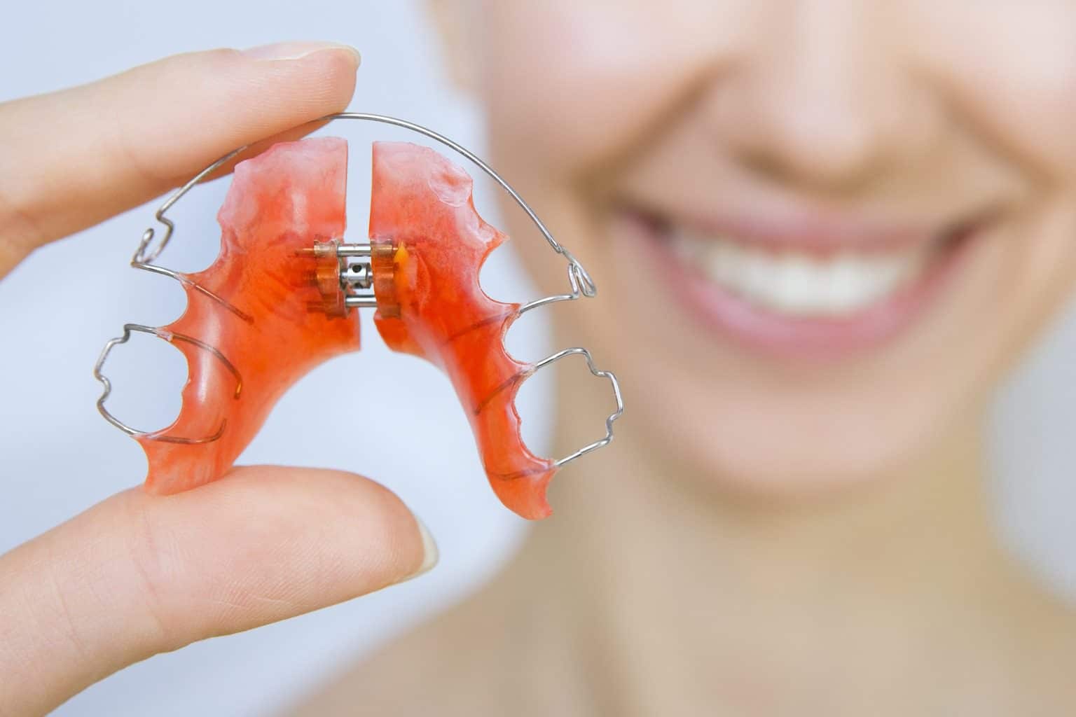 Woman holding a retainer